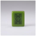 Green acrylic American Mahjong tile showing botanical engraved artwork