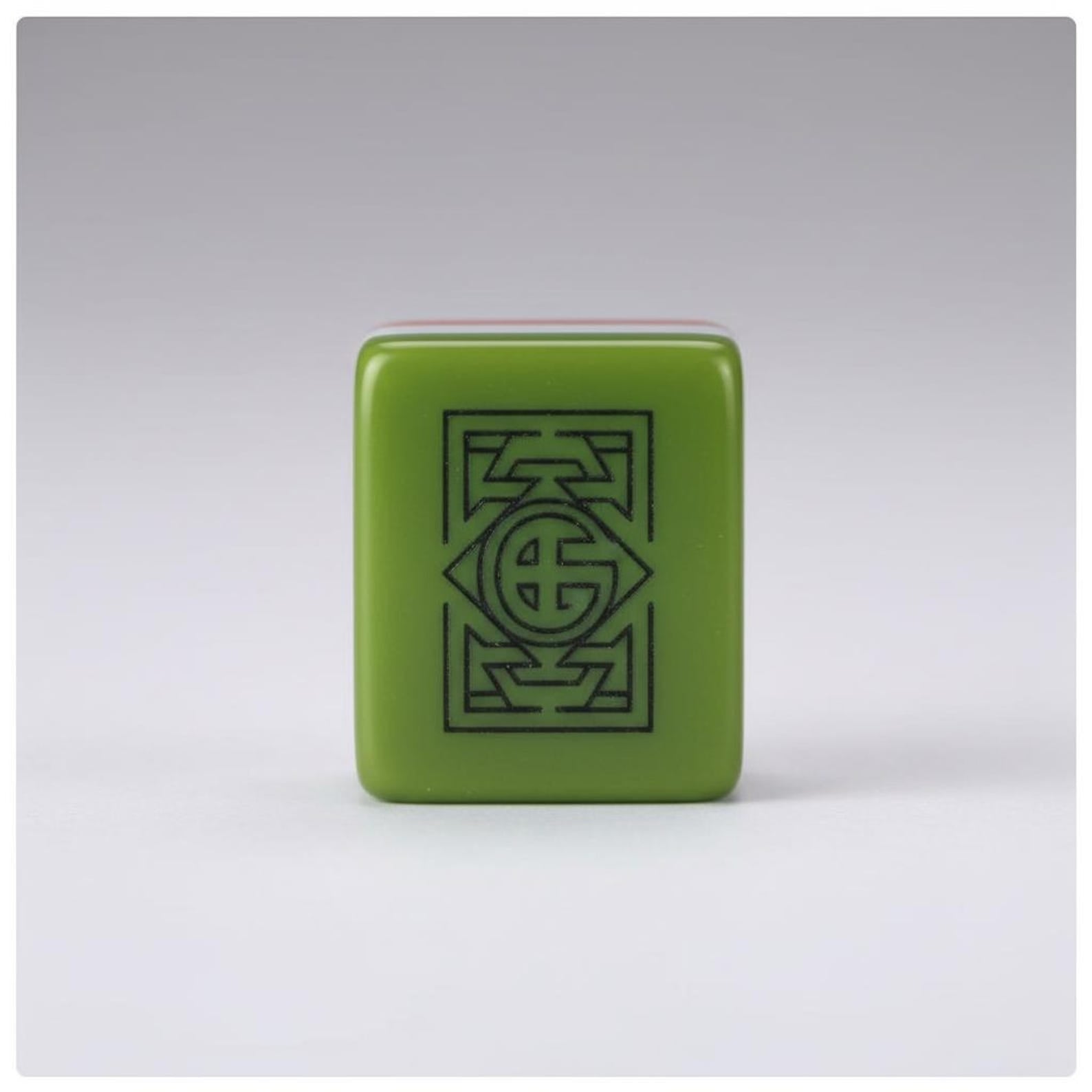 Green acrylic American Mahjong tile showing botanical engraved artwork